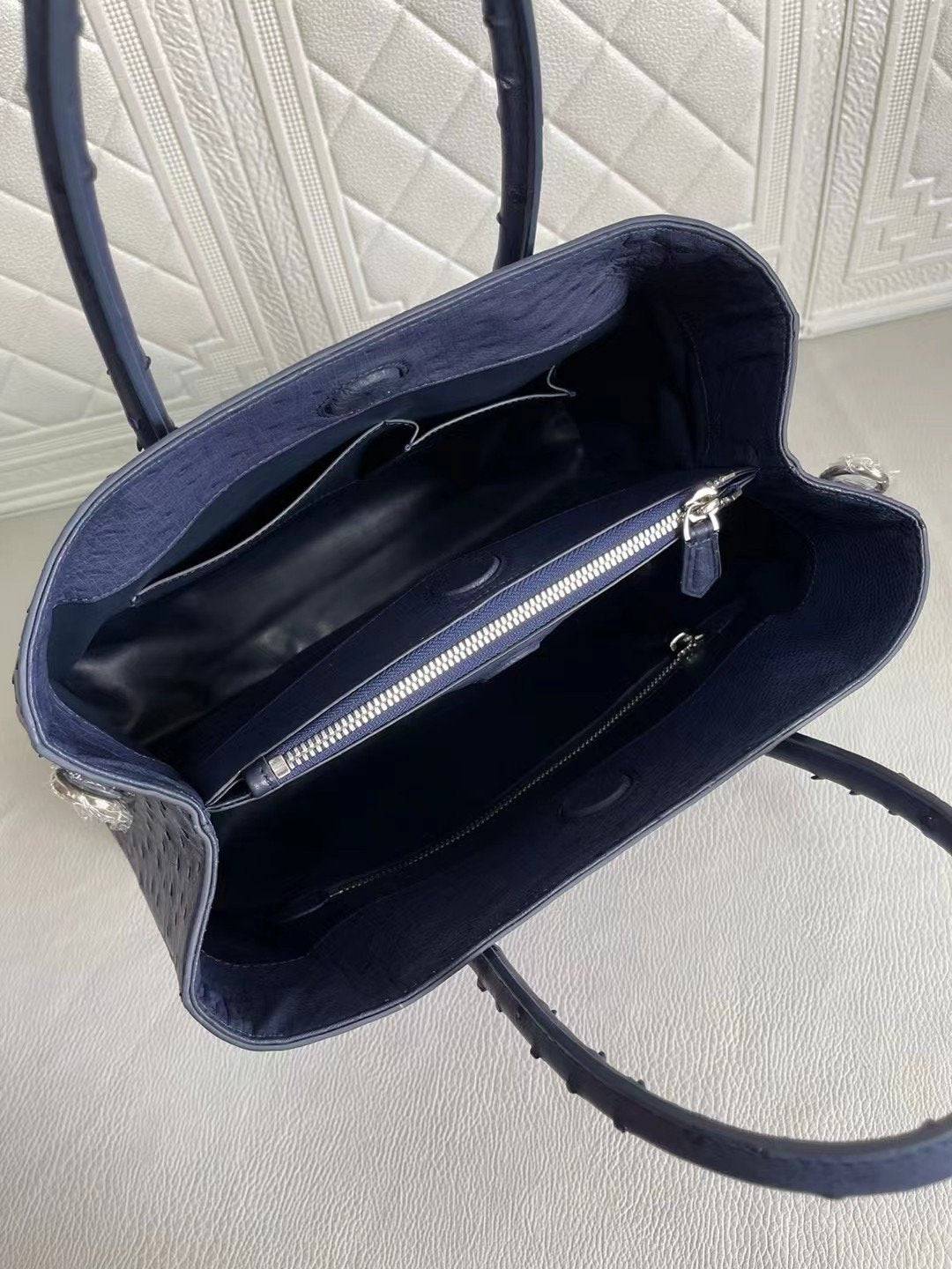 Rossie Viren women's ostrich leather handbag with top handle and crossbody strap in blue and purple, 33cm size.