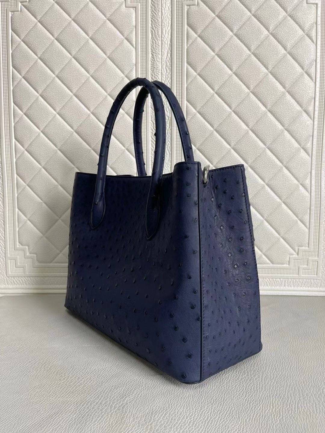 Rossie Viren women's ostrich leather handbag with top handle and crossbody strap in blue and purple, 33cm.