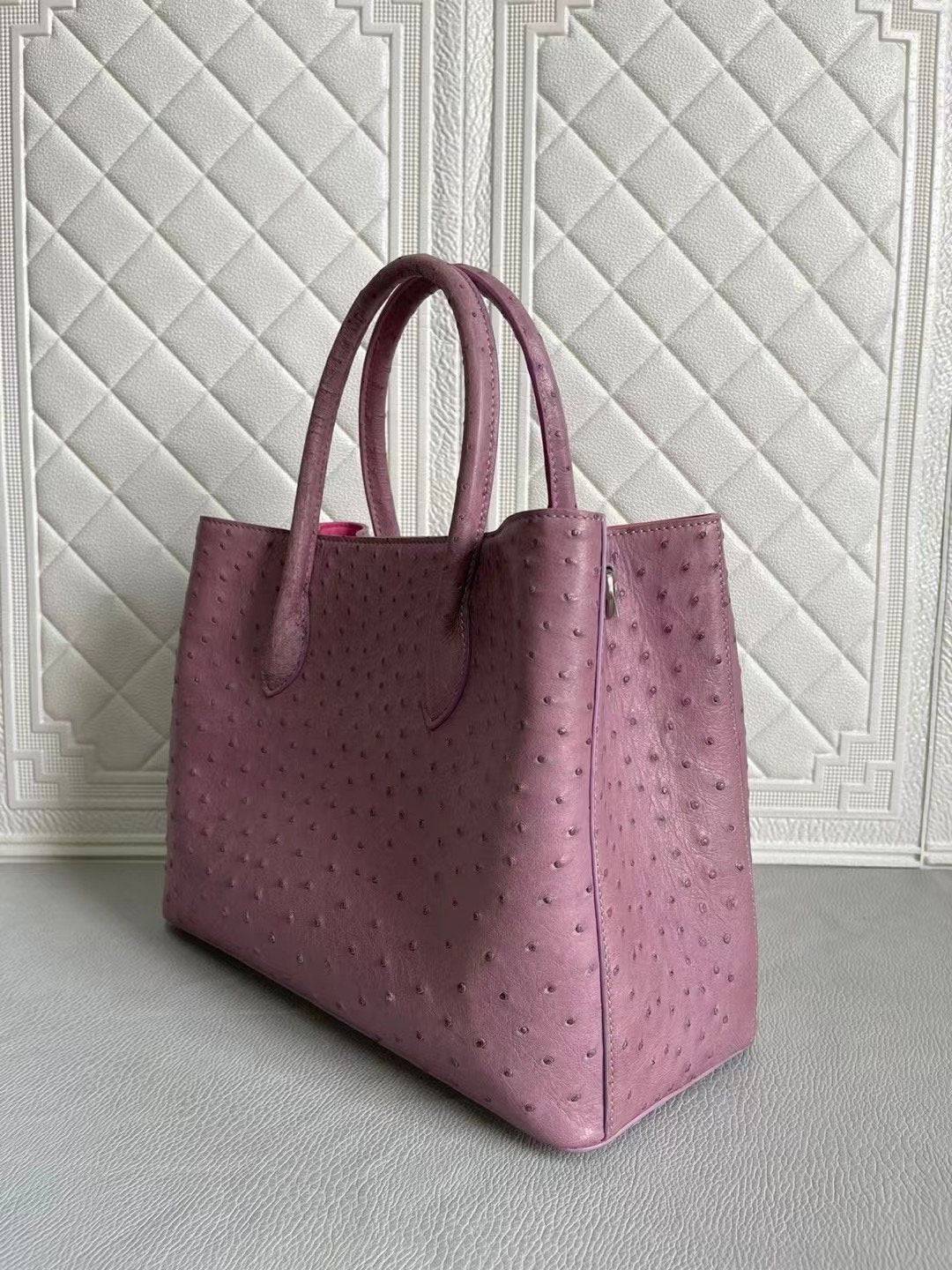 Rossie Viren women's ostrich leather handbag with top handle and crossbody strap in blue and purple, 33cm length.