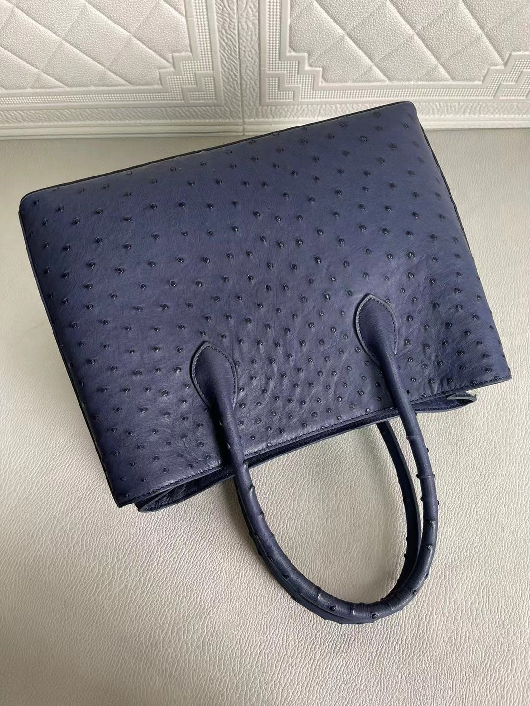 Rossie Viren women's ostrich leather handbag with top handle and crossbody strap in blue and purple, 33cm length.