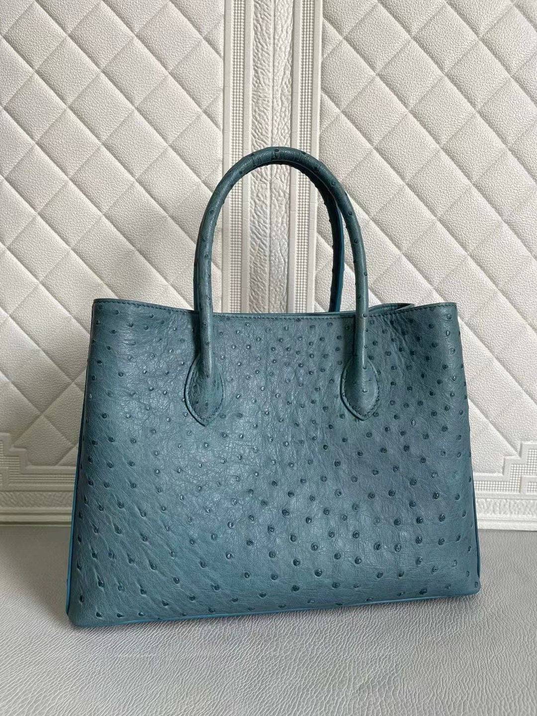 Rossie Viren women's ostrich leather handbag with top handle and crossbody strap in coral blue and yellow, 33cm size.