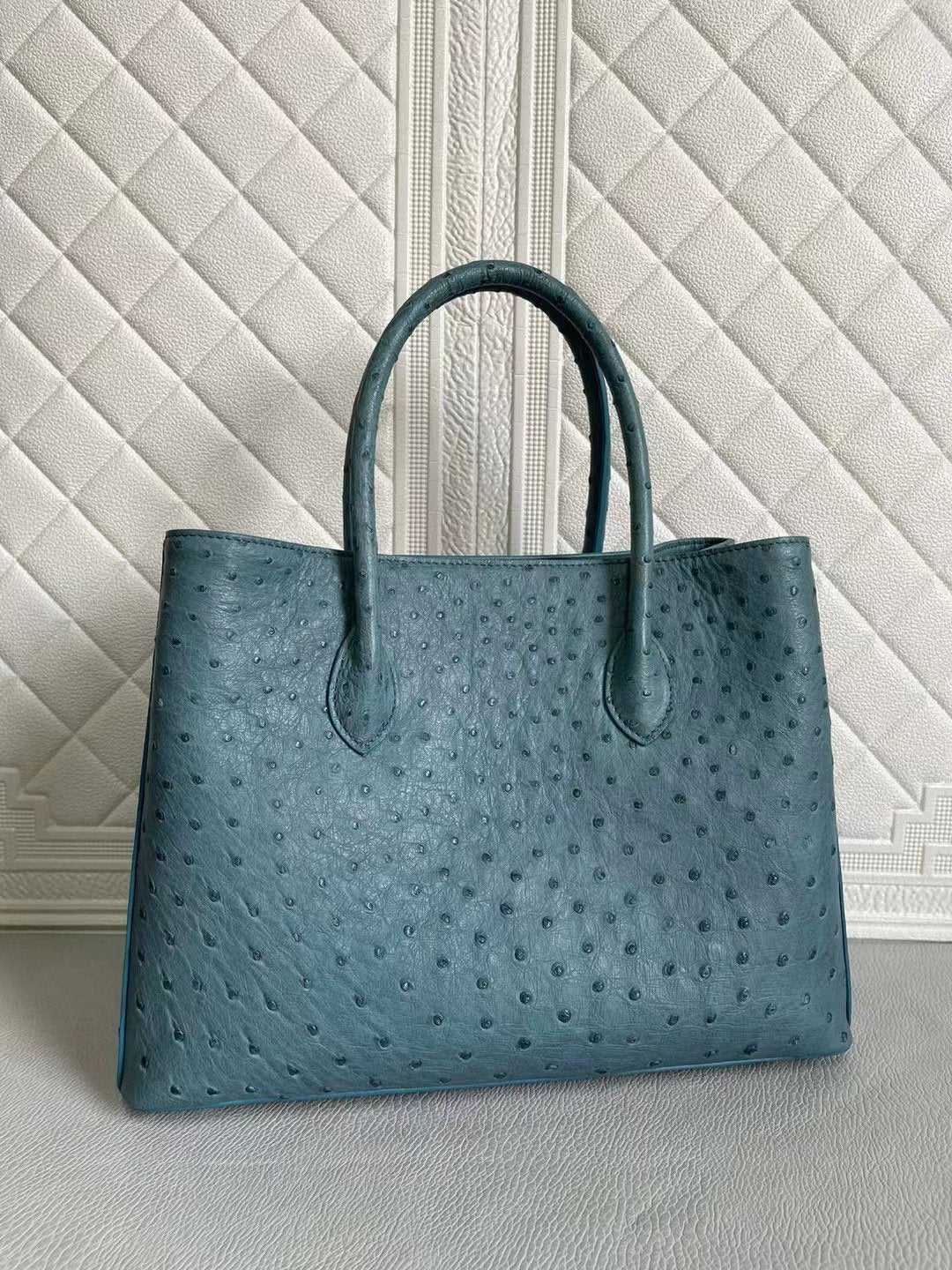 Rossie Viren women's ostrich leather handbag with top handle and crossbody strap in coral blue and yellow, 33cm size.