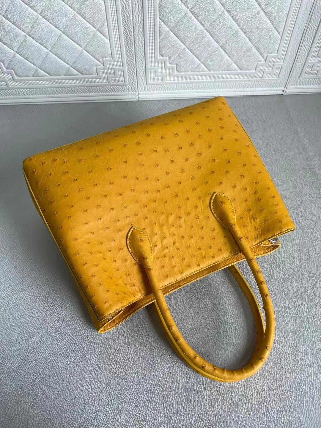 Rossie Viren women's ostrich leather handbag with top handle and crossbody strap in coral blue and yellow, 33cm size.