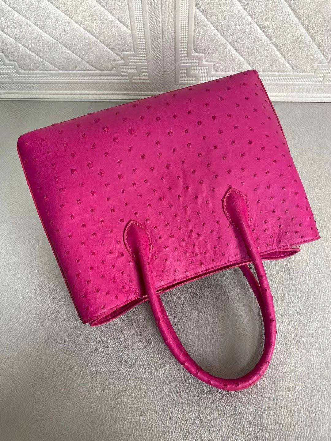 Rossie Viren women's ostrich leather handbag with top handle and crossbody strap in peach and green, 33cm size.