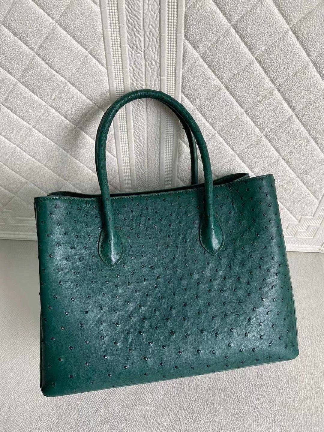Rossie Viren women's ostrich leather handbag with top handle and crossbody strap in peach and green, 33cm size.