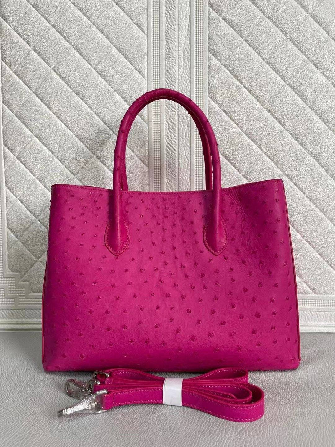 Rossie Viren women's ostrich leather handbag with top handle and crossbody strap in peach and green, 33cm size.