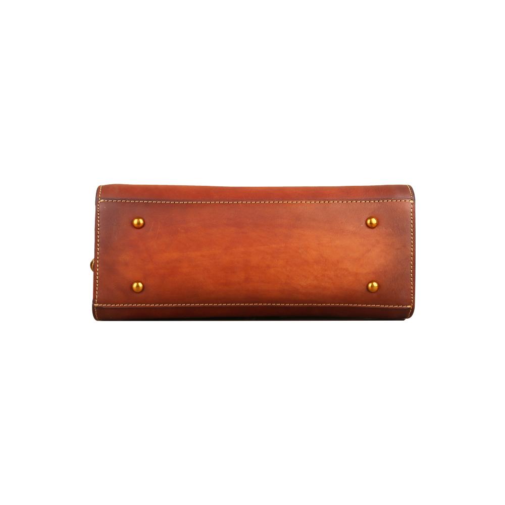 Women's vintage leather tote handbag with small top-handle, crafted by Rossie Viren, showcasing a classic and elegant design.