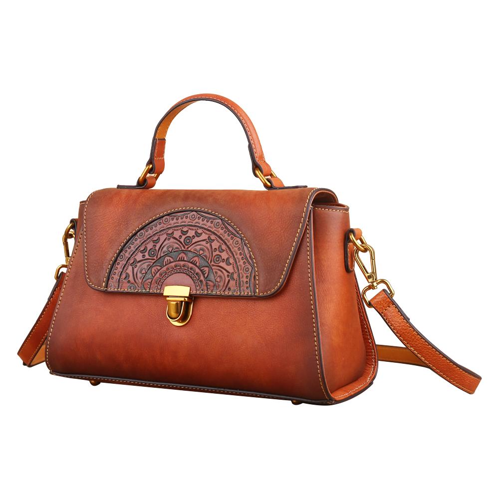 Women’s vintage leather tote handbag with small top-handle, Rossie Viren, showcasing its classic design and rich leather texture.