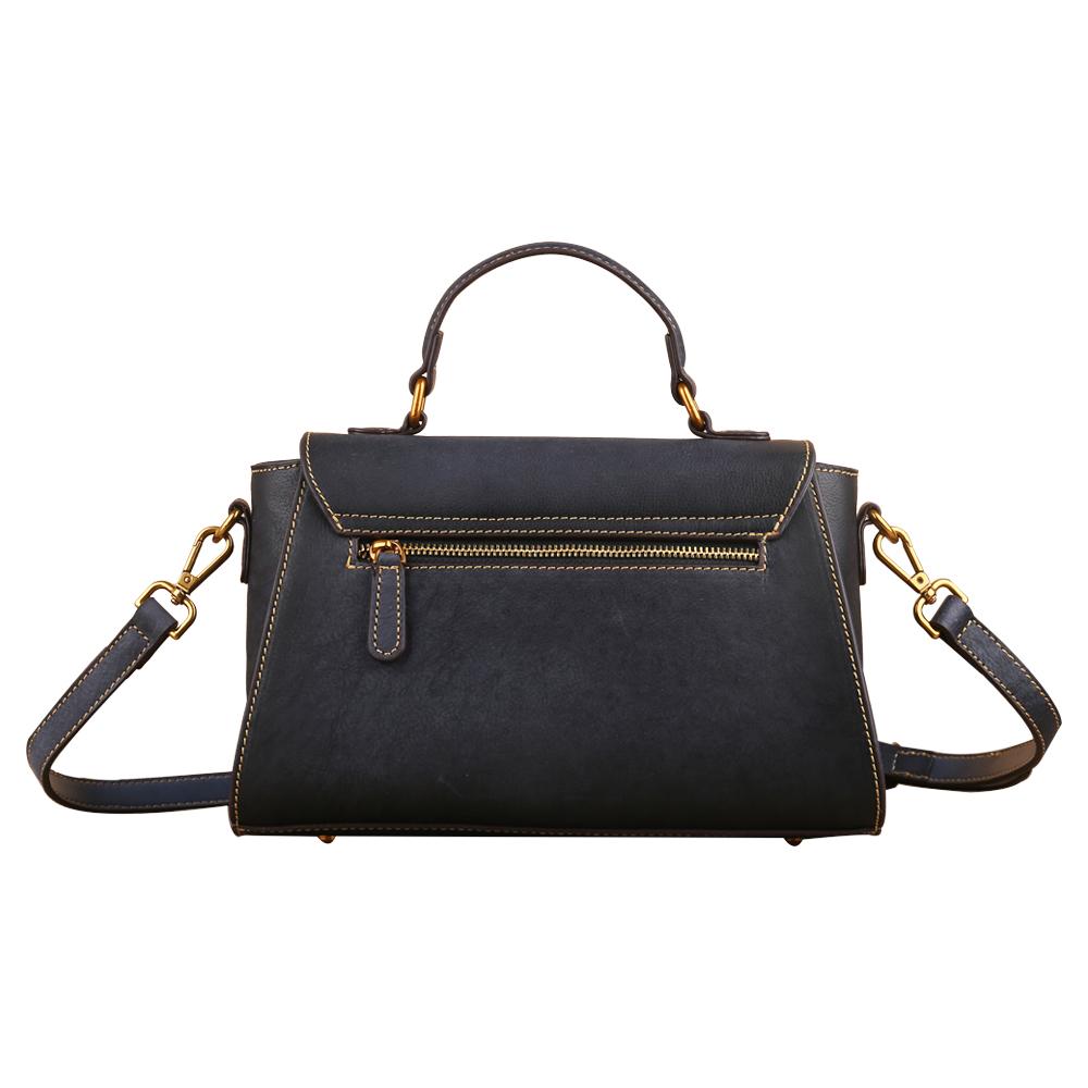 Women's vintage leather tote handbag with small top-handle, stylish and functional accessory by Rossie Viren.