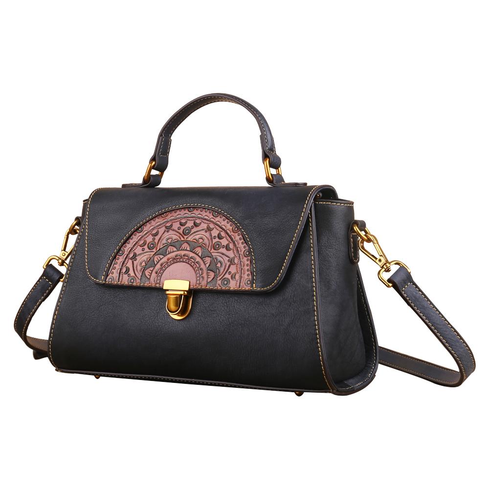 Women's vintage leather tote handbag with small top-handle design by Rossie Viren, featuring a classic, stylish look.