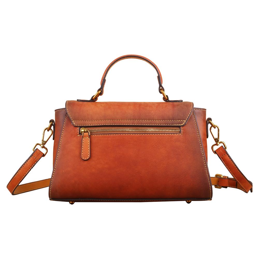 Women's vintage leather tote handbag with small top-handle, Rossie Viren brand, showcasing classic design and durable leather material.