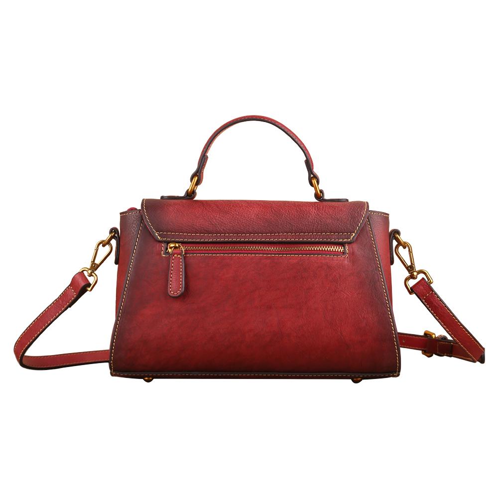 Women's vintage leather tote handbag with small top-handle, crafted by Rossie Viren, showing the classic design and brown leather texture.