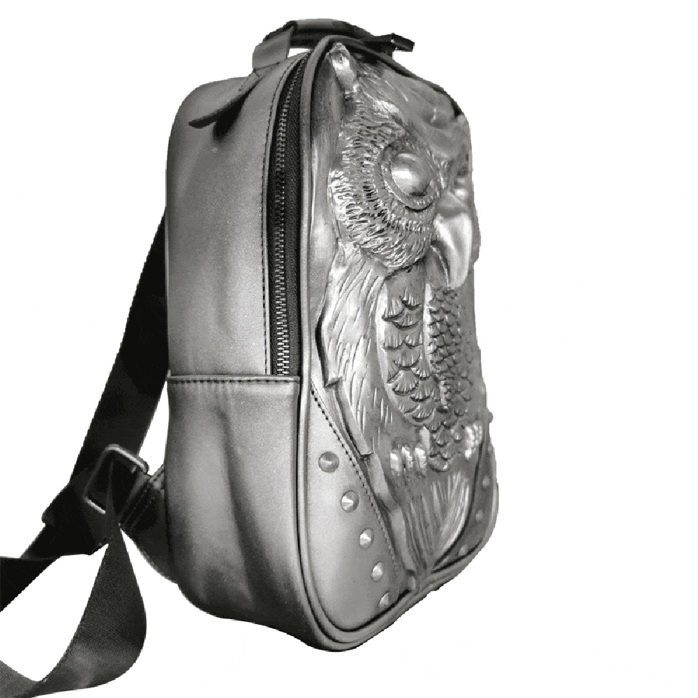 Silver 3D owl backpack for girls, embossed PU leather with graphic owl design, handle and shoulder strap, compact and stylish.