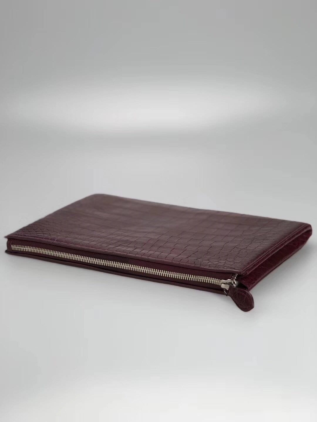 Rossie Viren crocodile belly leather large iPad case clutch bag, stylish and textured accessory with a sleek design.