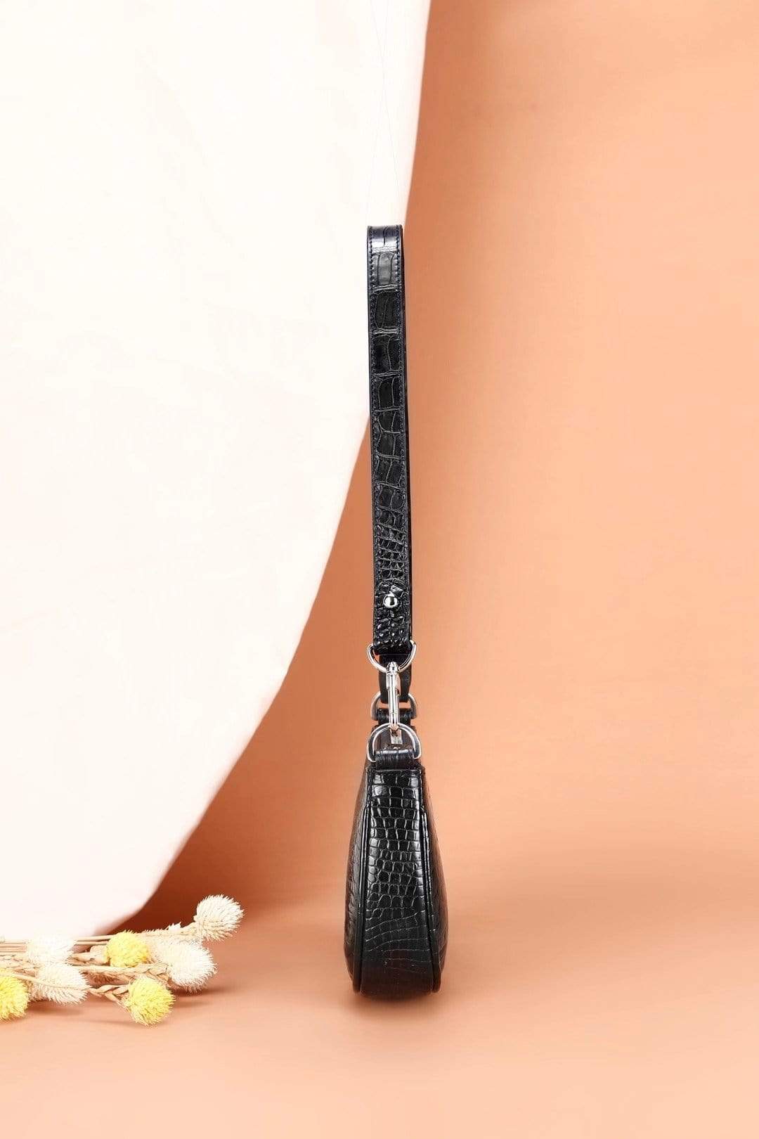 Rossie Viren crocodile leather underarm shoulder handbag with sleek design and textured crocodile pattern.