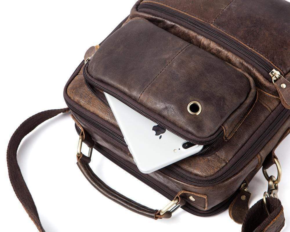Rossie Viren vintage crossbody handbag with two front pockets, grab handle, and long shoulder strap, stylish and functional.