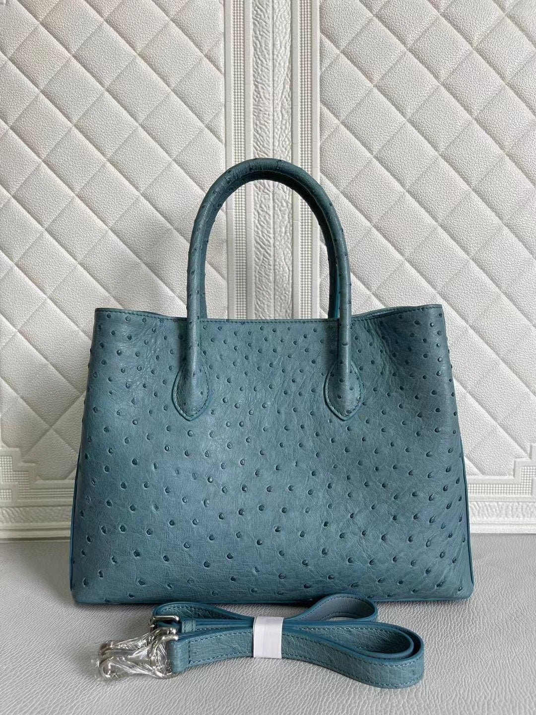 Rossie Viren women's ostrich leather handbag with top handle and crossbody strap in coral blue and yellow, 33cm size.